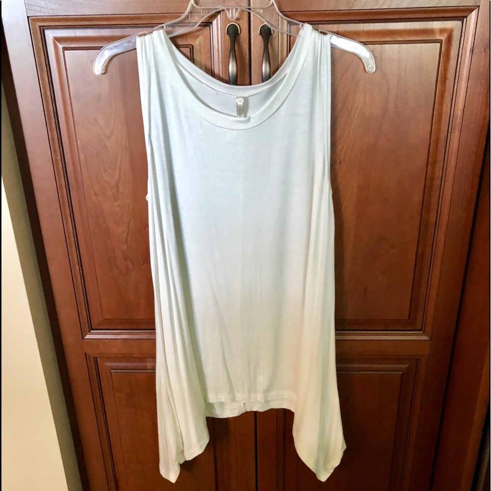 Cute white sleeveless top with interesting hemline
